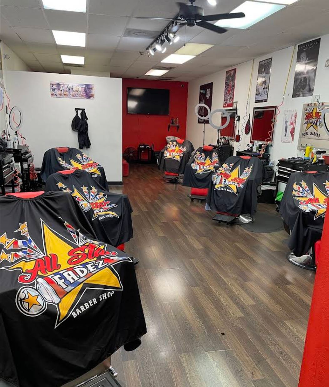 Inside All Star Fadez with branded capes on every chair